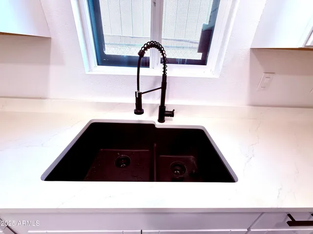 a view of a hallway with wooden floor and ceiling fan
