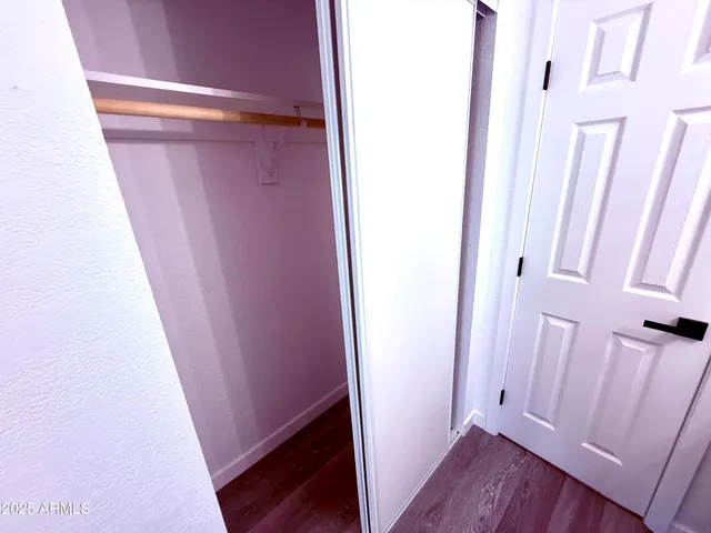 a bathroom with a sink toilet and mirror