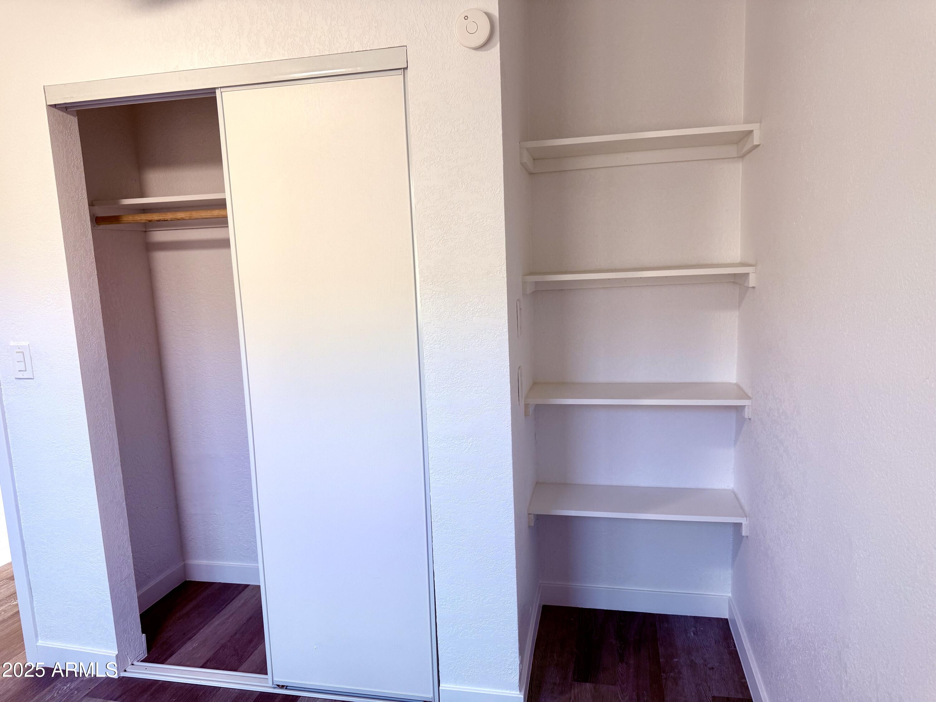 1009 East Chipman Road Phoenix, AZ 85040 - Photo 23 of 30 a view of walk in closet with empty racks