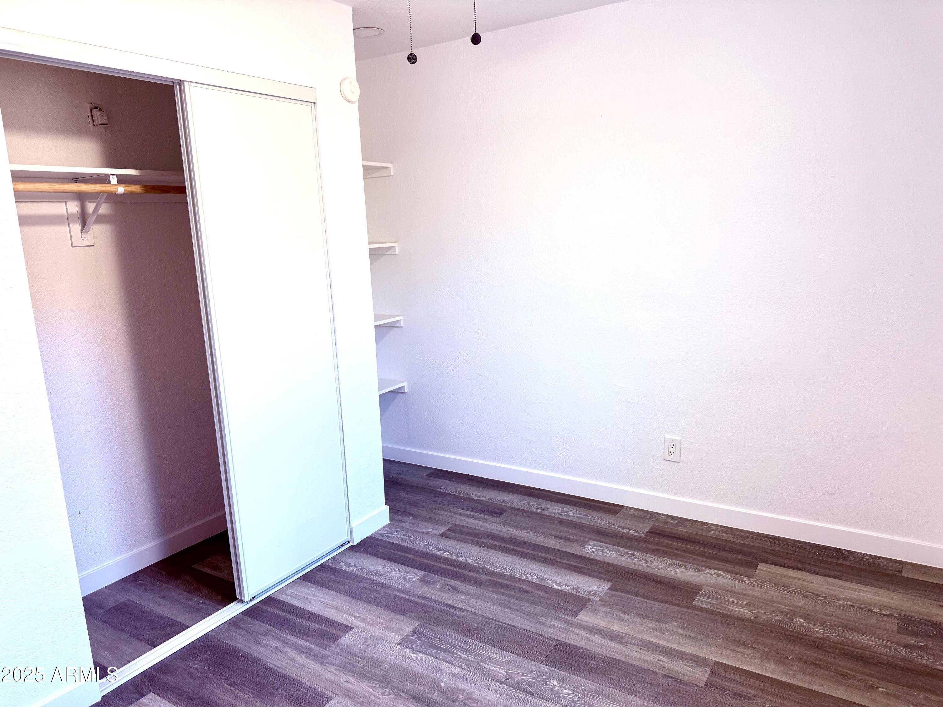 1009 East Chipman Road Phoenix, AZ 85040 - Photo 25 of 30 a view of a room with wooden floor