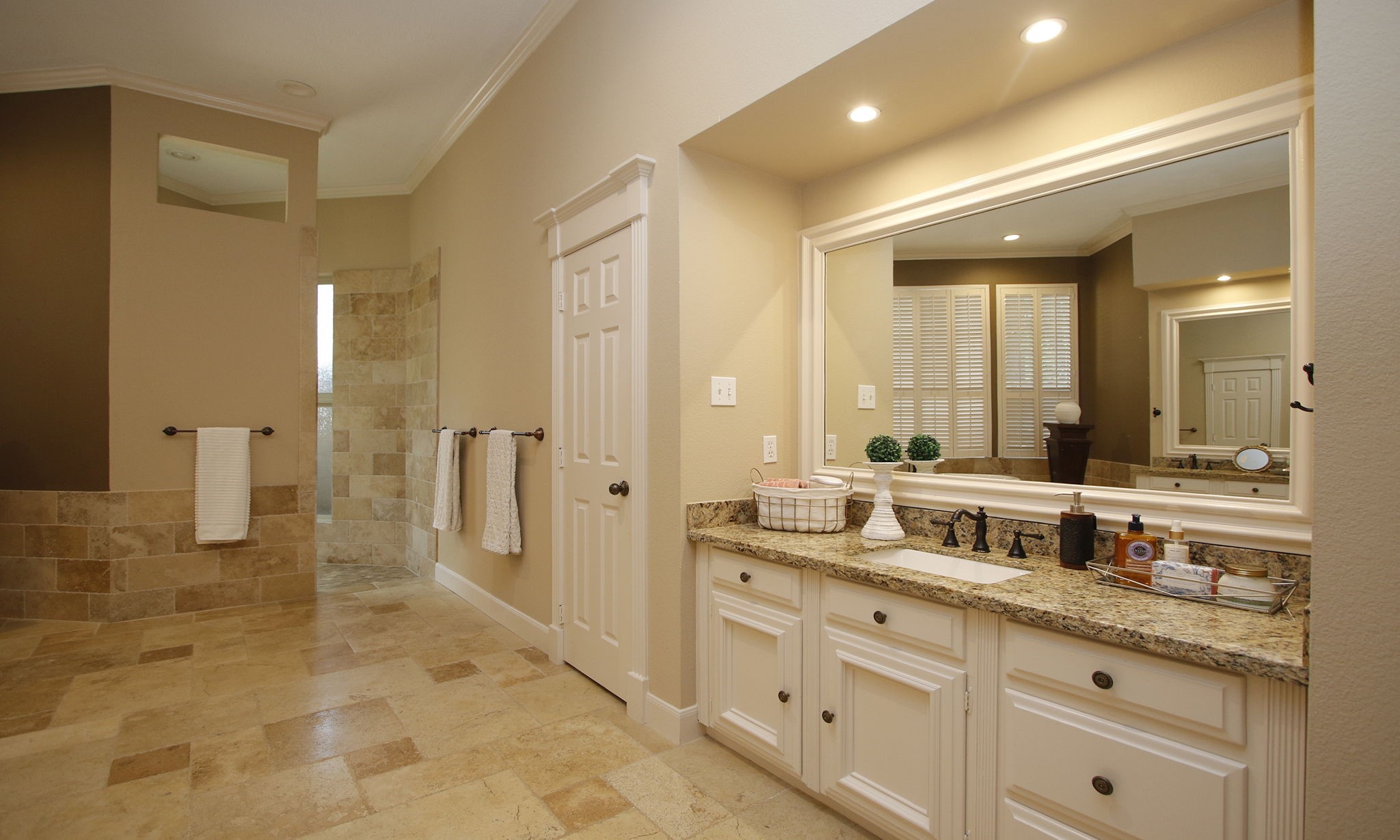 15923 Harwick Drive Spring, TX 77379 - Photo 16 of 50 On the opposite side of the primary bath, you'll find an additional granite-topped vanity, extensive Noche travertine flooring, and easy access to the oversized walk-in shower.