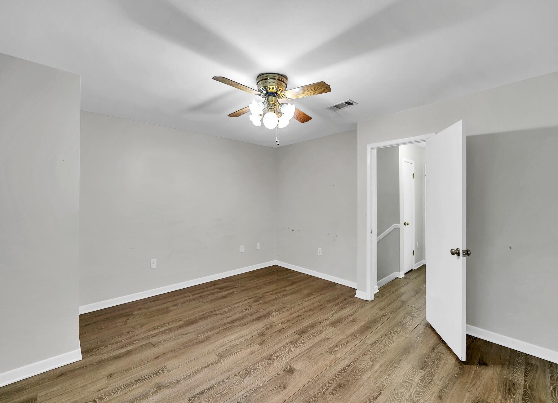 16 Gardner Drive Shalimar, FL 32579 - Photo 27 of 45 a view of an empty room with wooden floor