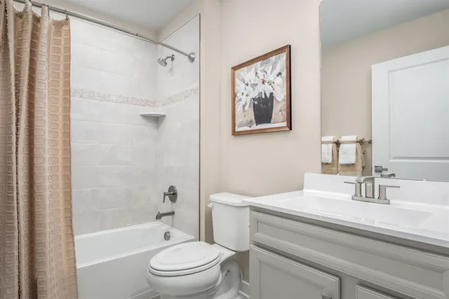 a bathroom with a sink a toilet and a bathtub