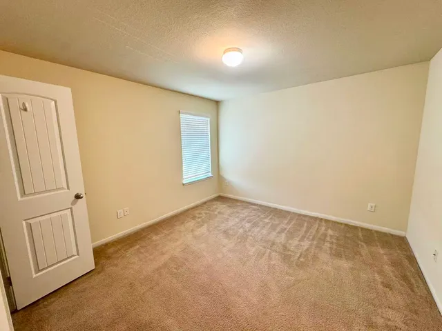 a view of a bathroom from a hallway