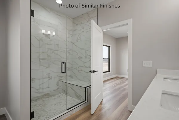 a bathroom with double vanity sink a two mirror a lamp and vanity