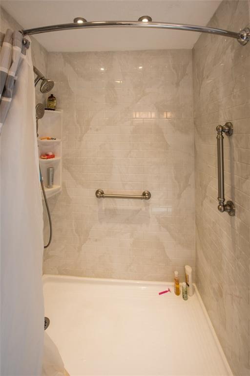 747 Beaver Road Greensburg, PA 15601 - Photo 14 of 24 Spacious walk-in shower with stylish gray and white subway title.