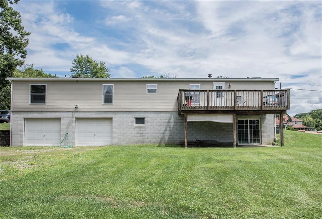 747 Beaver Road Greensburg, PA 15601 - Photo 21 of 24 The back of the house has a 2-car garage and a patio under the deck.
