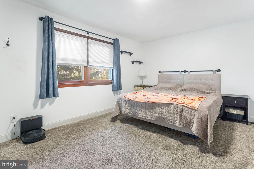 2276 Ridge Road York, PA 17406 - Photo 14 of 34 a bedroom with a bed and a couch