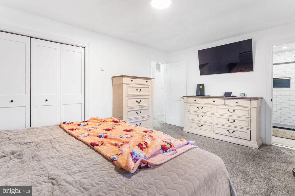 2276 Ridge Road York, PA 17406 - Photo 15 of 34 a bedroom with a bed and a flat screen tv