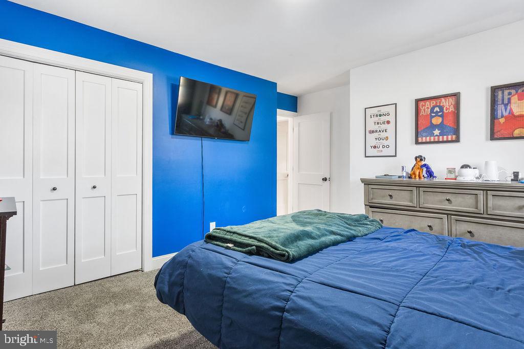 2276 Ridge Road York, PA 17406 - Photo 18 of 34 a bedroom with a bed and a dresser in it