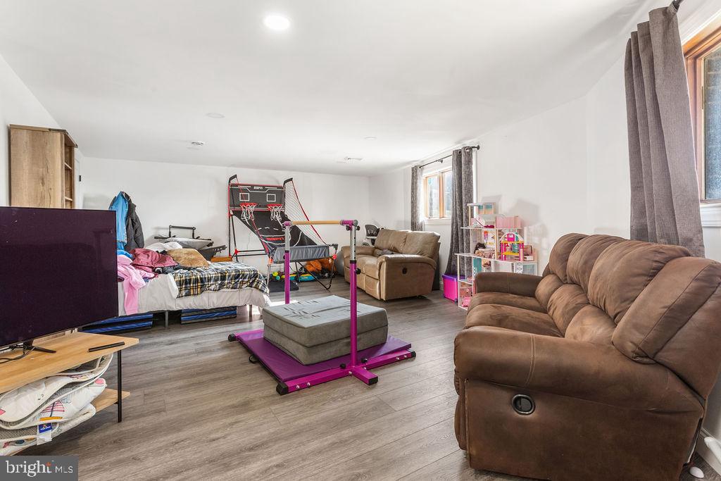 2276 Ridge Road York, PA 17406 - Photo 20 of 34 a living room with furniture a rug and a flat screen tv