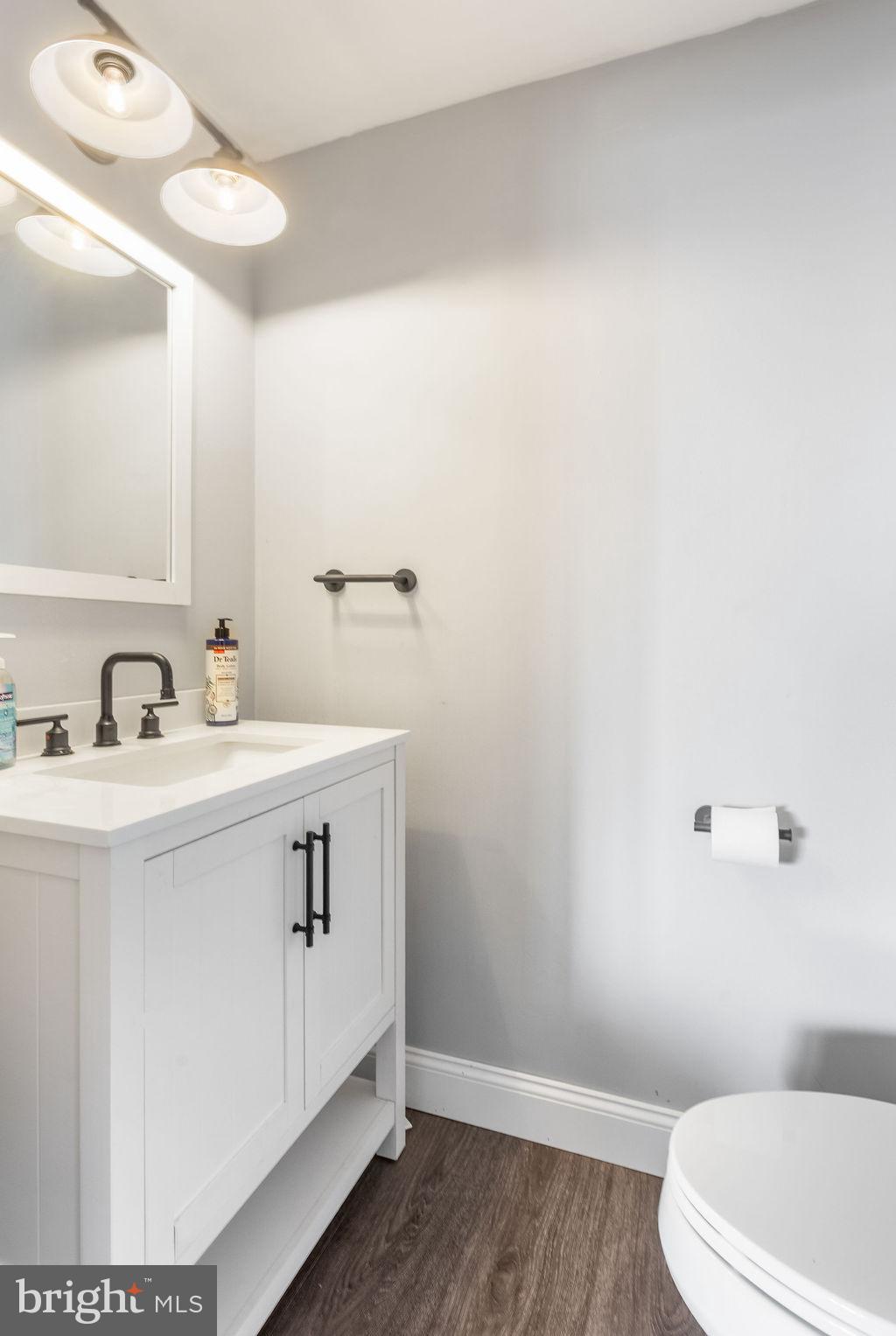 2276 Ridge Road York, PA 17406 - Photo 23 of 34 a bathroom with a sink a toilet and a mirror