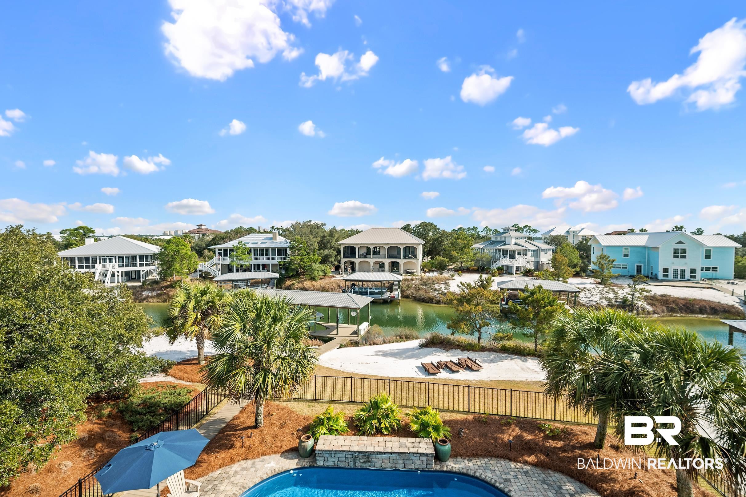 33186 Marlin Key Drive Orange Beach, AL 36561 - Photo 74 of 87 View of pool featuring patio surround, a water view, and a residential view
