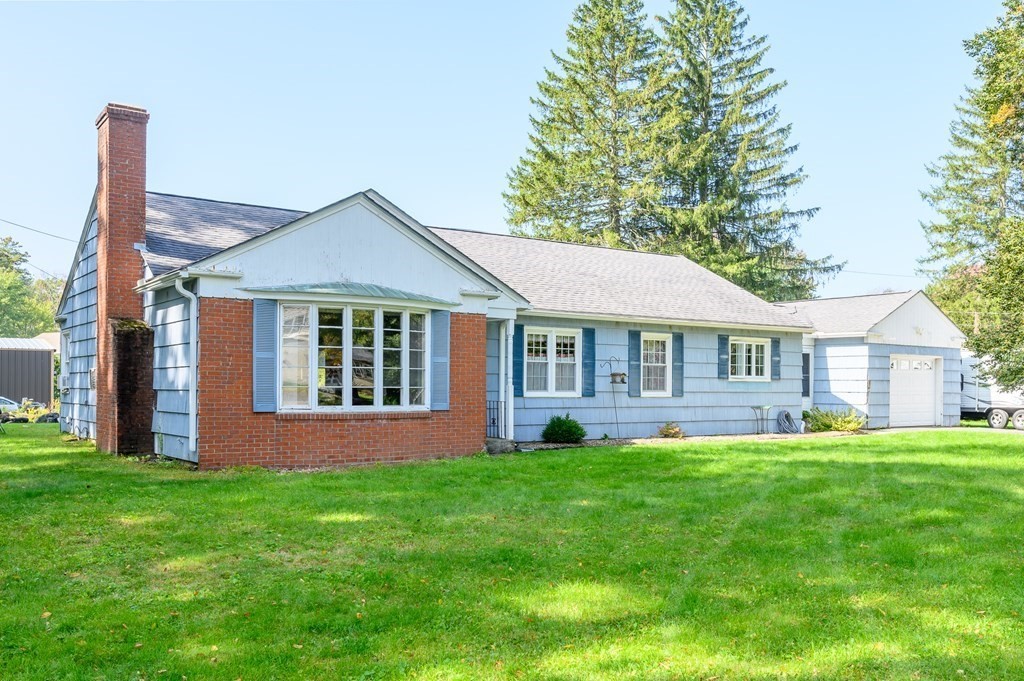 627 Pleasant Street Athol, MA 01331 - Photo 13 of 16 a front view of a house with a yard and porch