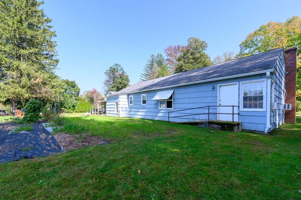 627 Pleasant Street Athol, MA 01331 - Photo 15 of 16 a view of a backyard with plants and a garden