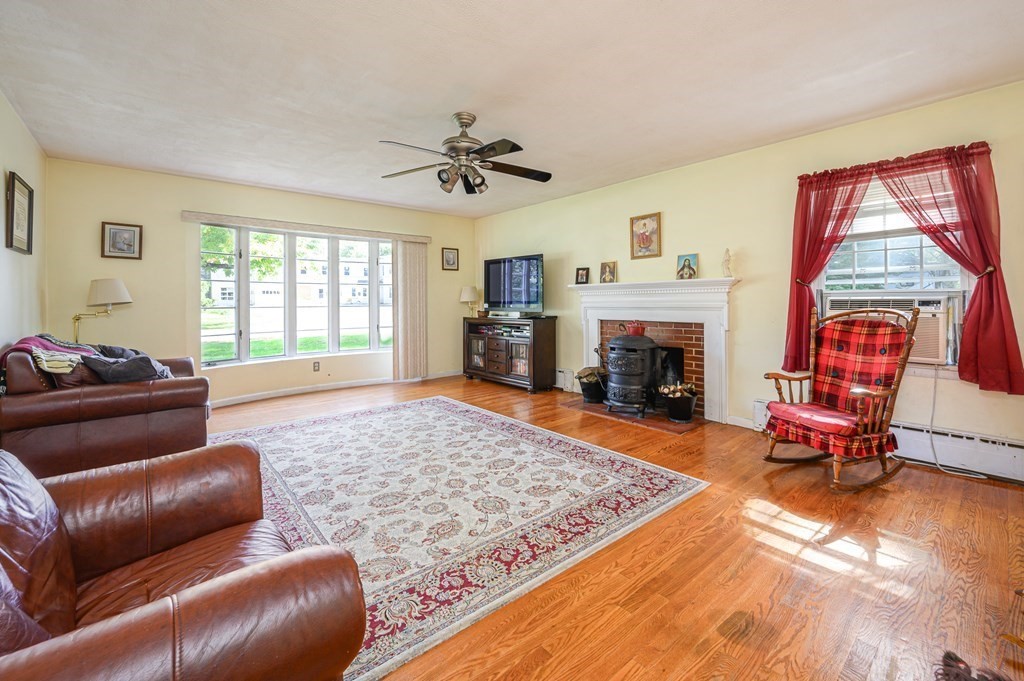 627 Pleasant Street Athol, MA 01331 - Photo 3 of 16 a living room with furniture and a fireplace