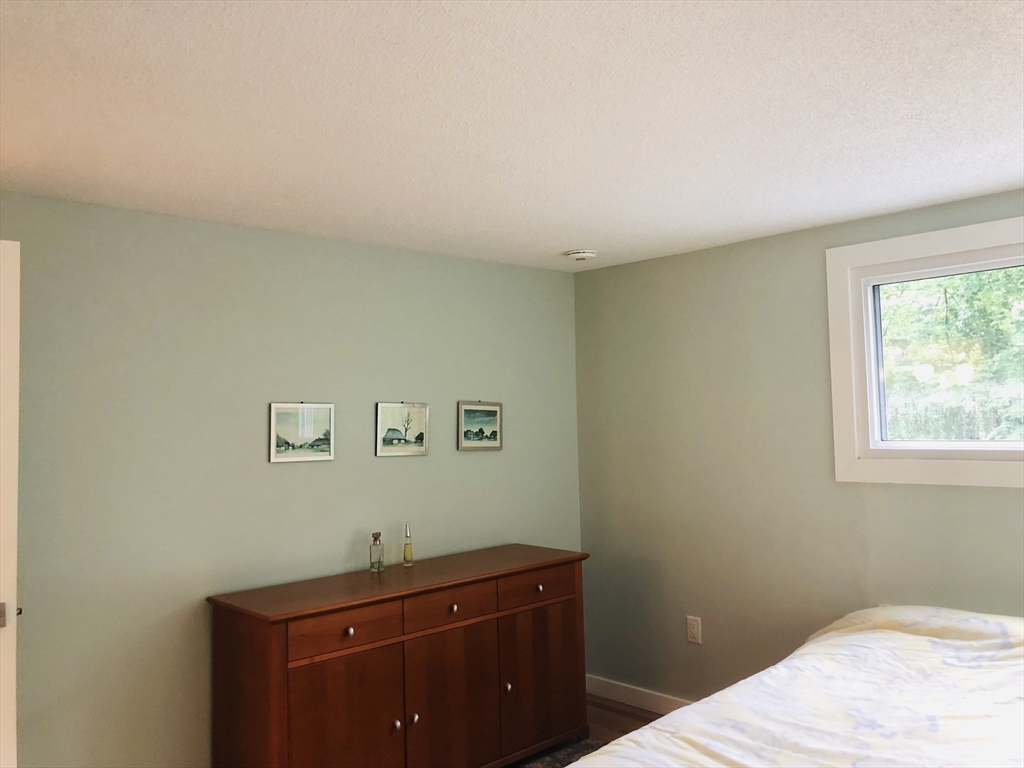 99 Lacy Road Jaffrey, NH 03452 - Photo 18 of 29 a room with a bed and a window