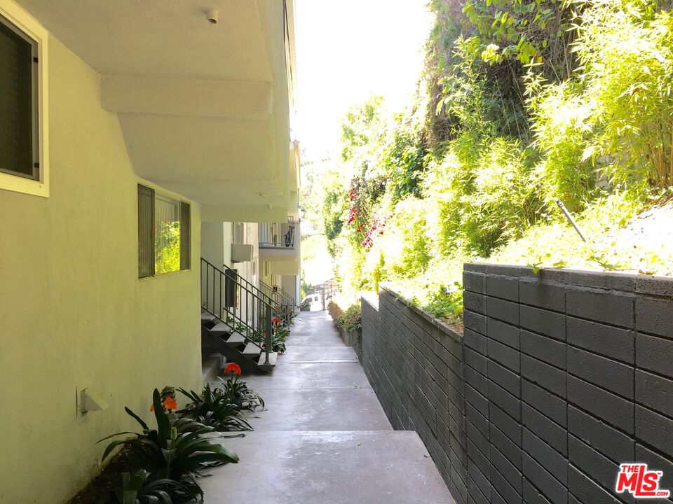 1920 Hillcrest Road, Unit 5 Los Angeles, CA 90068 - Photo 16 of 17 a view of a balcony with wooden floor