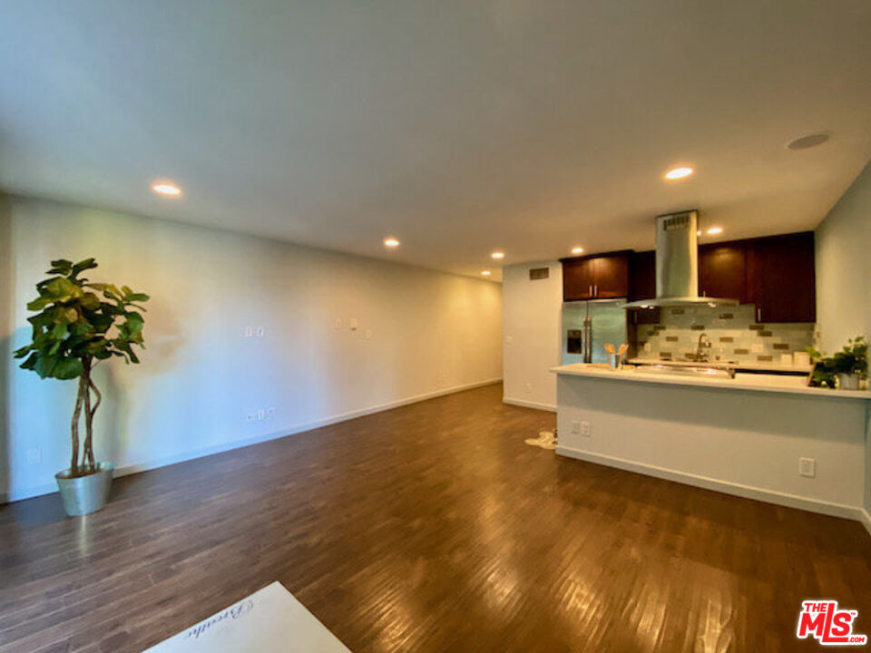 1920 Hillcrest Road, Unit 5 Los Angeles, CA 90068 - Photo 5 of 17 a view of kitchen with stainless steel appliances refrigerator stove microwave and cabinets