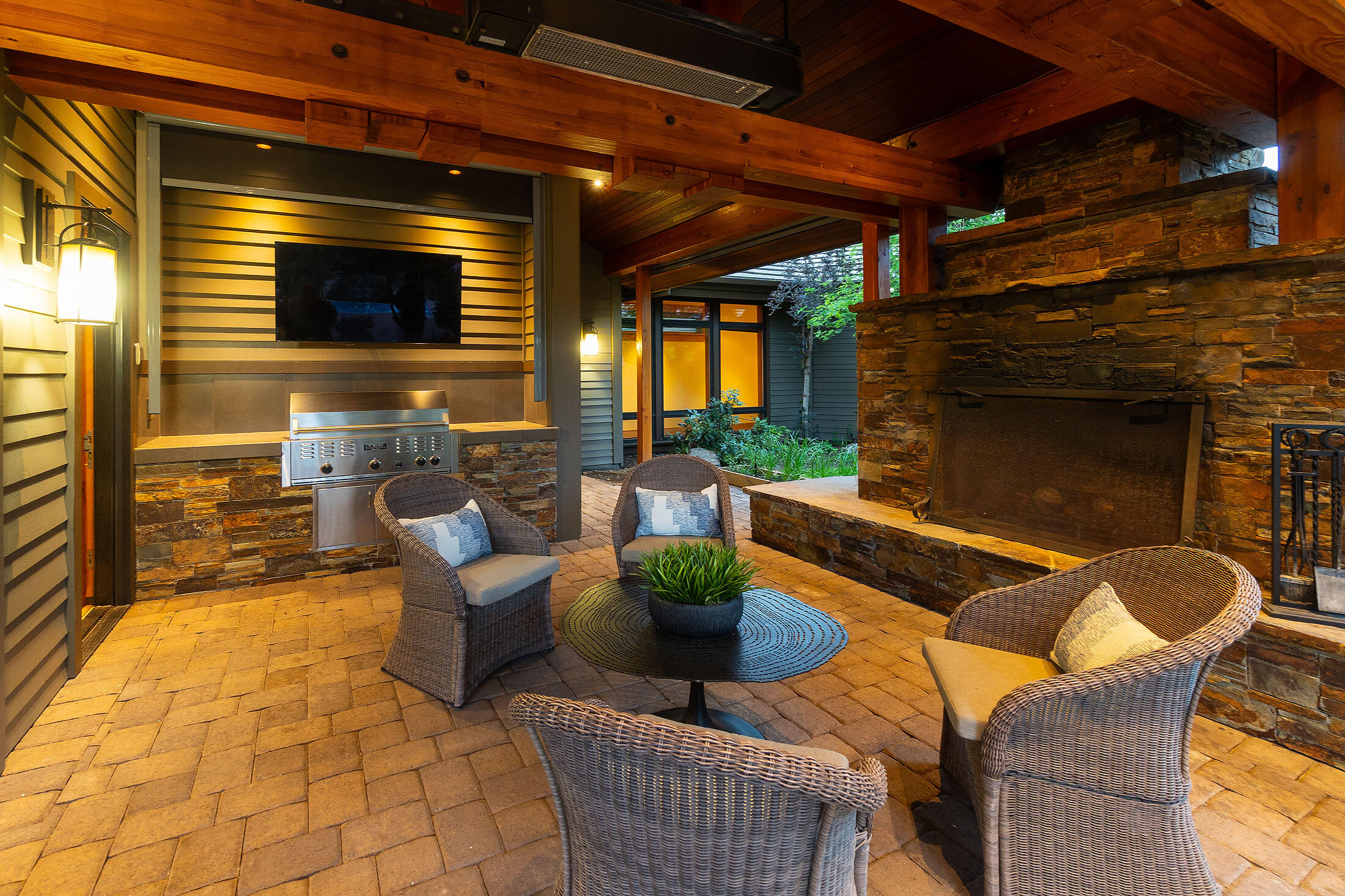 18883 Sutherland Court Bend, OR 97702 - Photo 46 of 70 Alfresco gatherings come alive beside the outdoor fireplace and built-in grill statio.