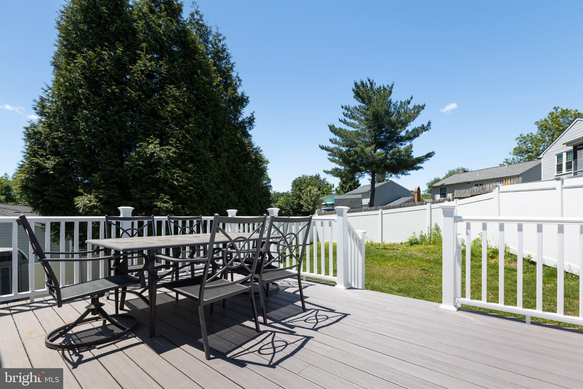 3613 Rusty Rim Ellicott City, MD 21043 - Photo 35 of 39 Sunny deck with serene backyard view.