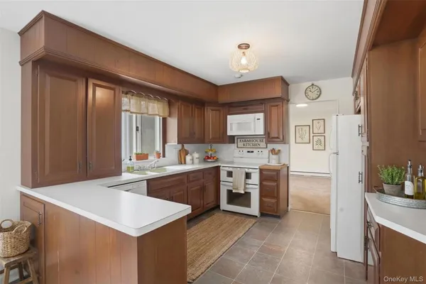 a large kitchen with cabinets and stainless steel appliances