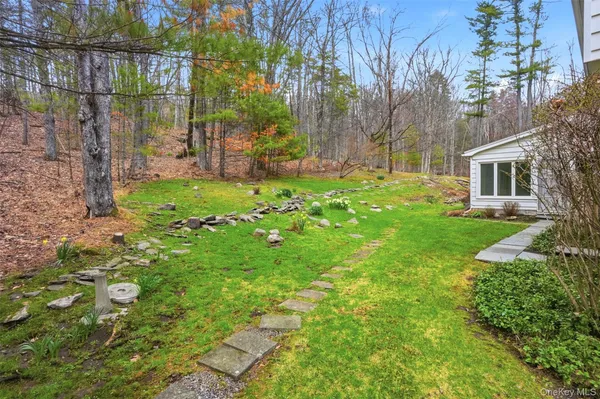 a view of backyard with a garden and plants