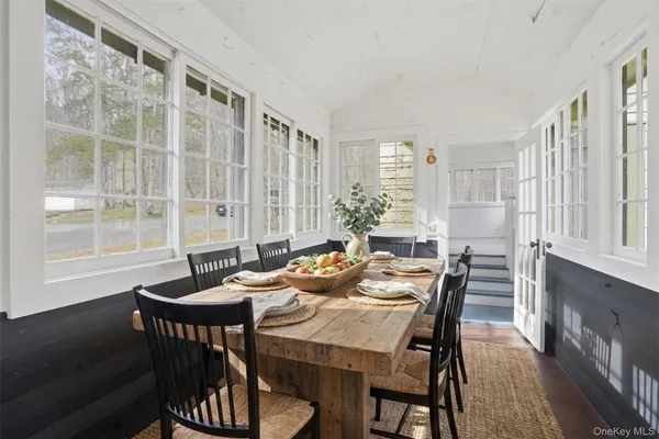 a view of a dining room with furniture window and outside view
