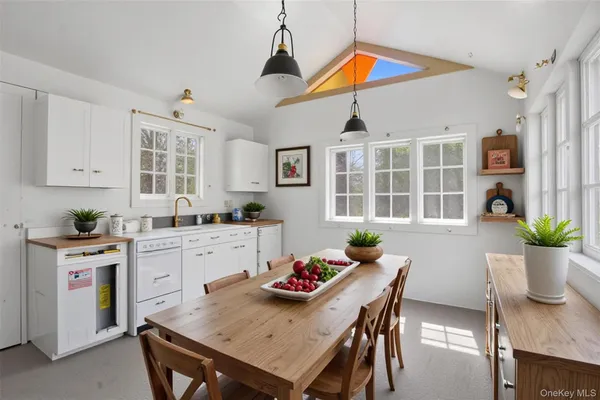 a dining room with furniture and window