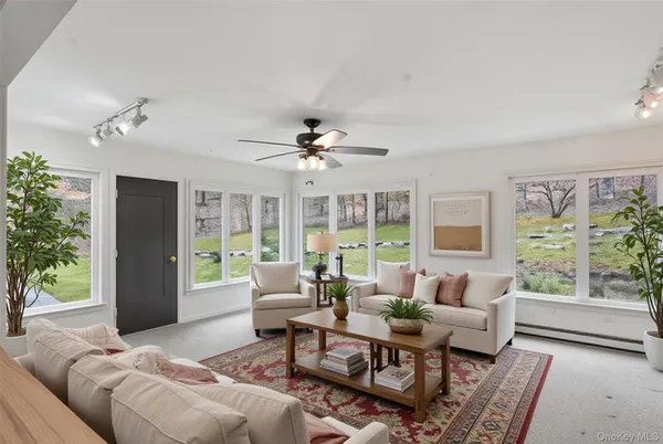 a living room with furniture and a large window