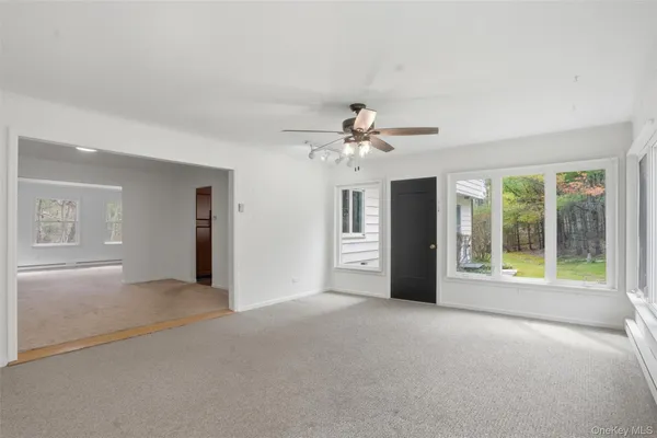 a view of an empty room with a window