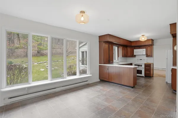 a kitchen with a stove a sink and a refrigerator