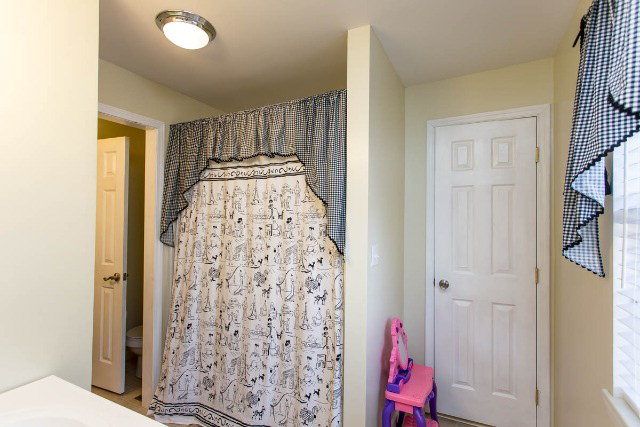 5492 Bankston Lake Road Macon, GA 31216 - Photo 22 of 25 a bathroom with a shower curtain and a window