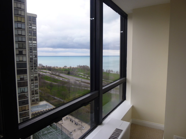 5415 North Sheridan Road, Unit 2311 Chicago, IL 60640 - Photo 12 of 18 a view of a glass door with a balcony from a window