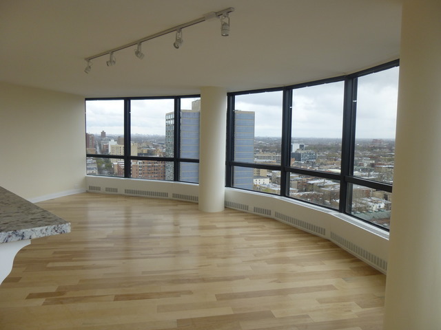5415 North Sheridan Road, Unit 2311 Chicago, IL 60640 - Photo 2 of 18 a view of an empty room with a window