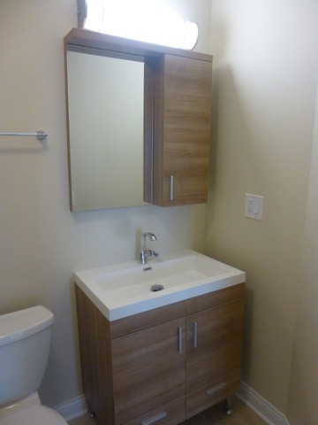 5415 North Sheridan Road, Unit 2311 Chicago, IL 60640 - Photo 8 of 18 a bathroom with a sink and a toilet