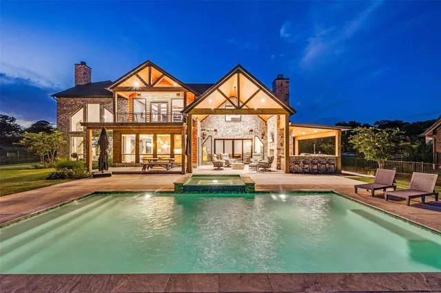 a view of a house with swimming pool