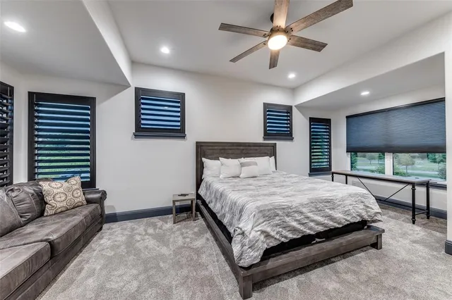 a bedroom with a large bed and a couch