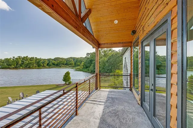 a view of swimming pool with a patio and a backyard