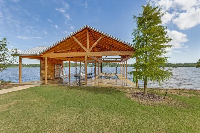 a view of a patio with couches table and chairs and potted plants