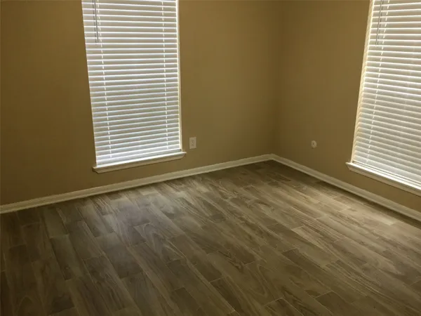 a view of an empty room and a window