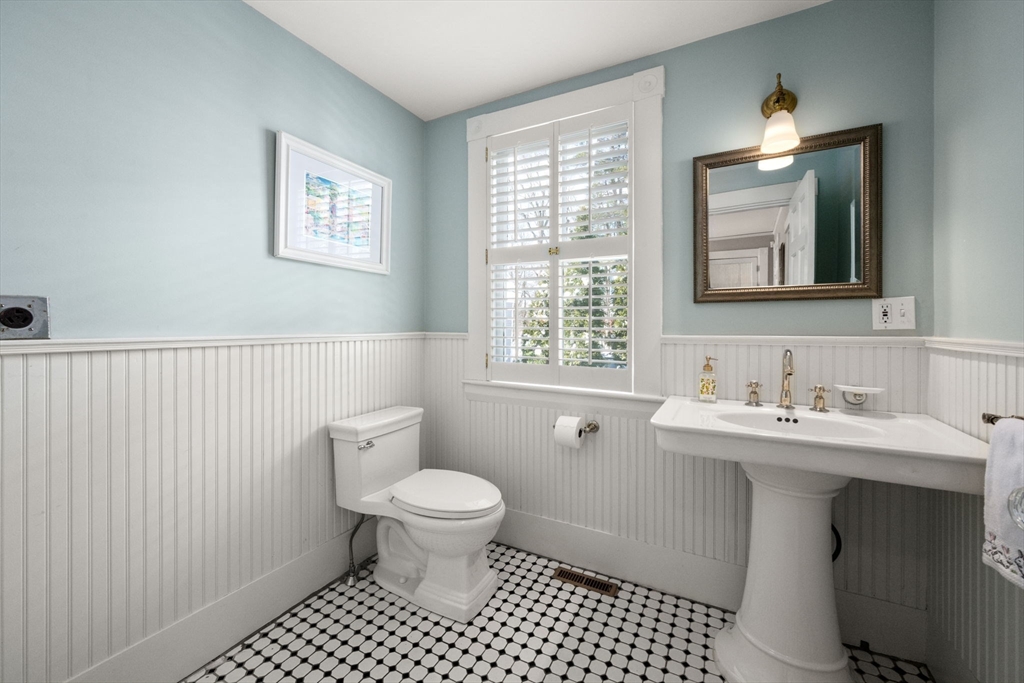 2 Old Sudbury Road Wayland, MA 01778 - Photo 14 of 40 a bathroom with a toilet a sink and mirror