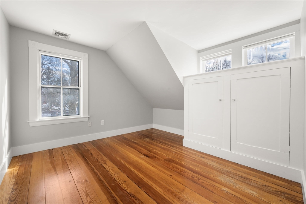 2 Old Sudbury Road Wayland, MA 01778 - Photo 25 of 40 an empty room with wooden floor and windows