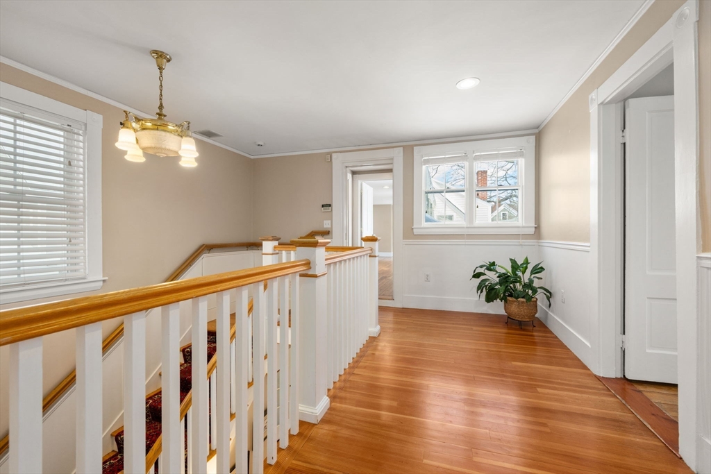 2 Old Sudbury Road Wayland, MA 01778 - Photo 27 of 40 a view of a hallway with wooden floor and stairs