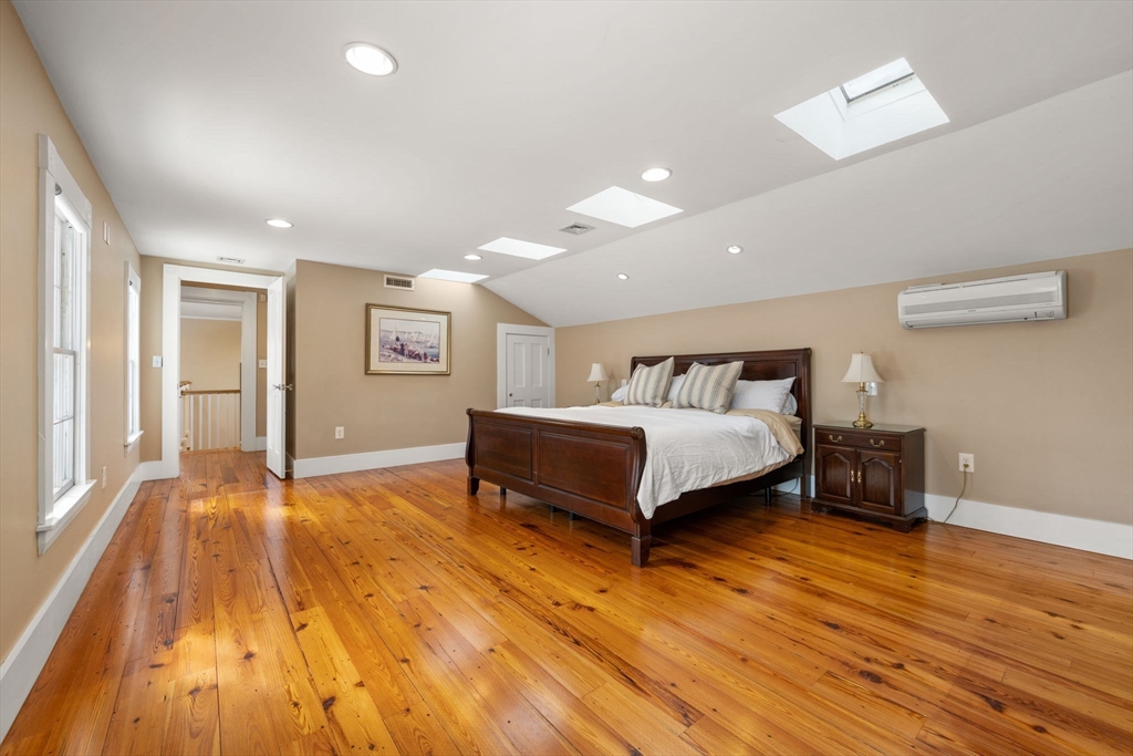 2 Old Sudbury Road Wayland, MA 01778 - Photo 29 of 40 a spacious bedroom with a bed and wooden floor