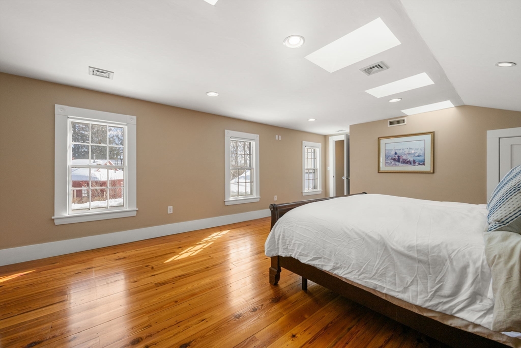 2 Old Sudbury Road Wayland, MA 01778 - Photo 30 of 40 a bedroom with a bed and wooden floor