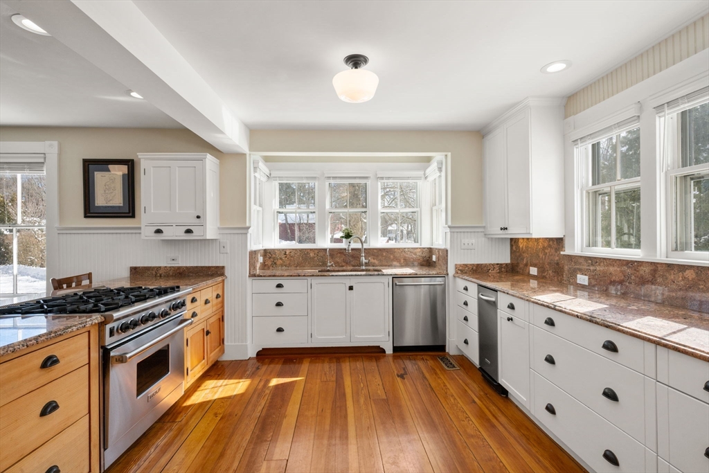2 Old Sudbury Road Wayland, MA 01778 - Photo 3 of 40 a kitchen with granite countertop stainless steel appliances a stove sink and cabinets
