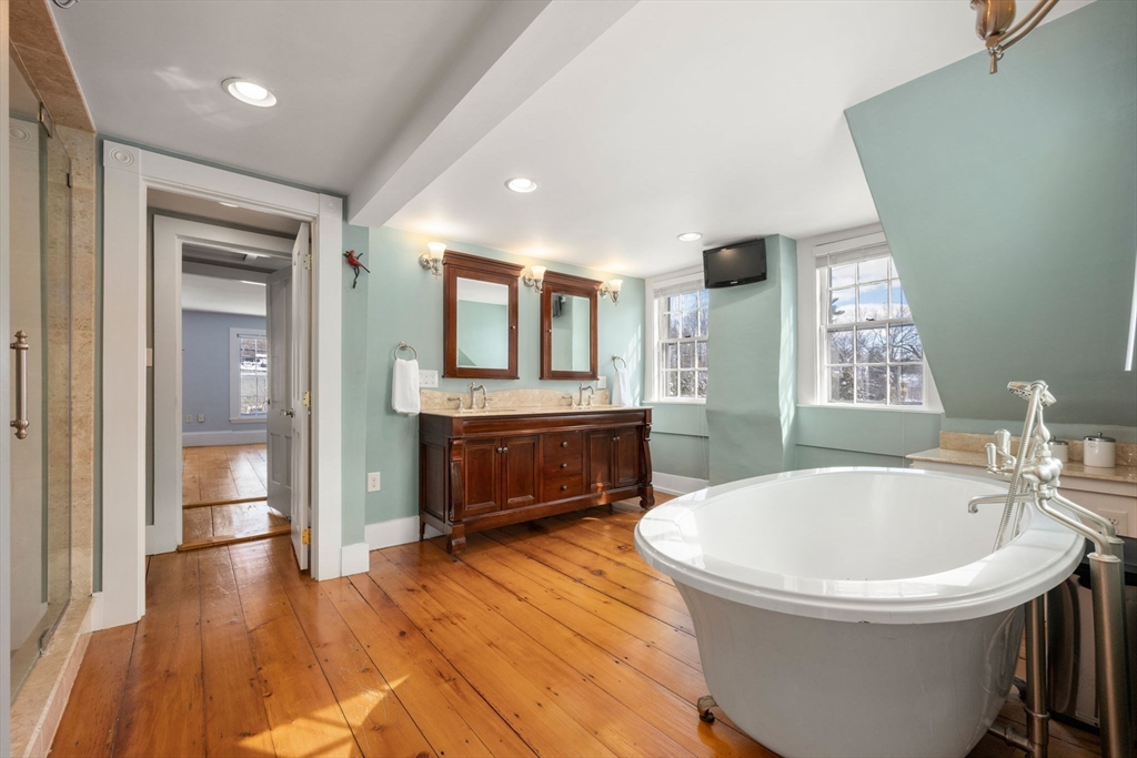 2 Old Sudbury Road Wayland, MA 01778 - Photo 31 of 40 a bathroom with a bathtub sink and mirror