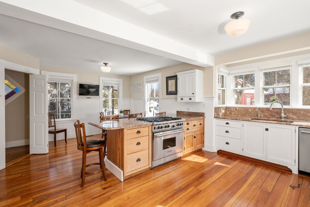 2 Old Sudbury Road Wayland, MA 01778 - Photo 5 of 40 a large kitchen with cabinets wooden floor and stainless steel appliances