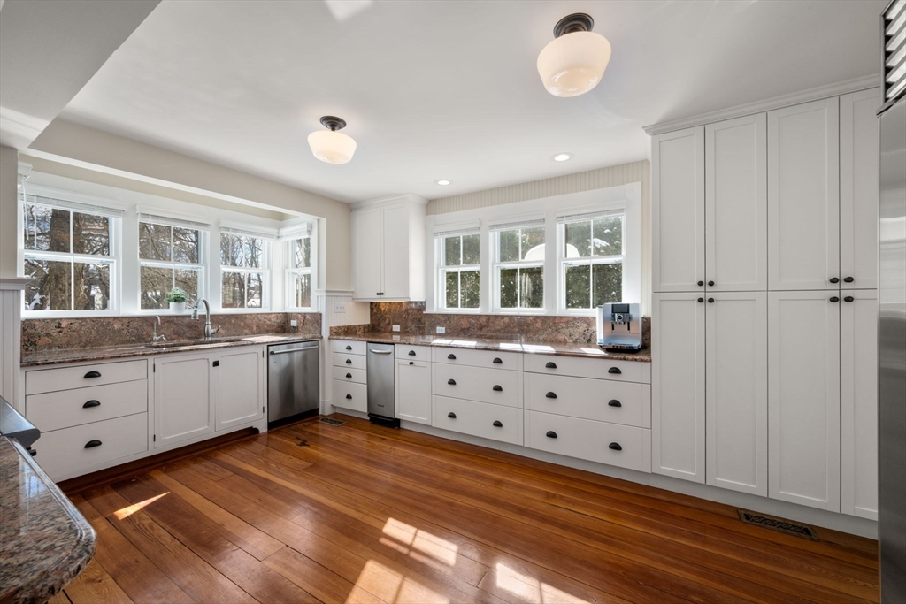 2 Old Sudbury Road Wayland, MA 01778 - Photo 6 of 40 a kitchen with granite countertop a white stove top oven and a refrigerator